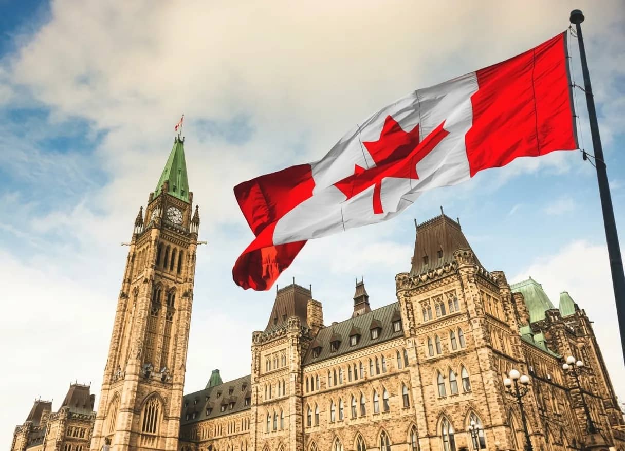 Parliament Hill in Ottawa with the Canadian flag flying above the Centre Block